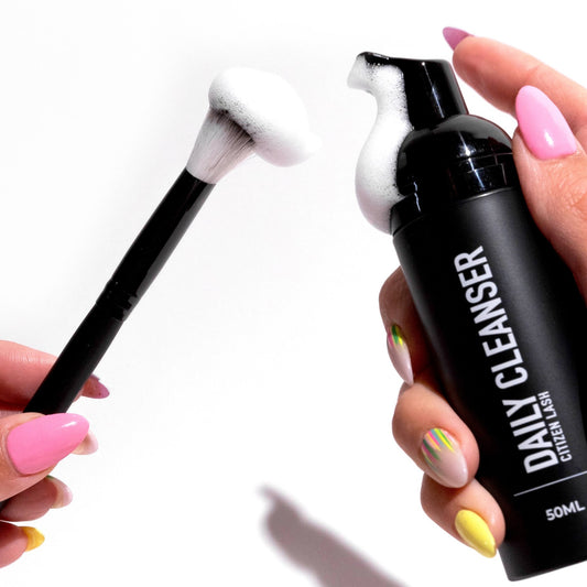 pumping daily cleanser onto cleansing brush to clean diy lash extensions